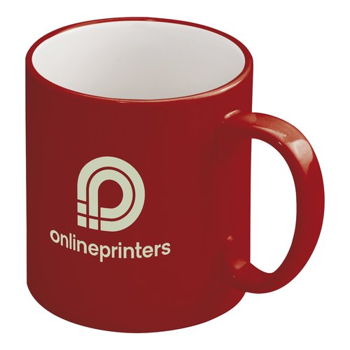 Taza roja de cermica con asa.