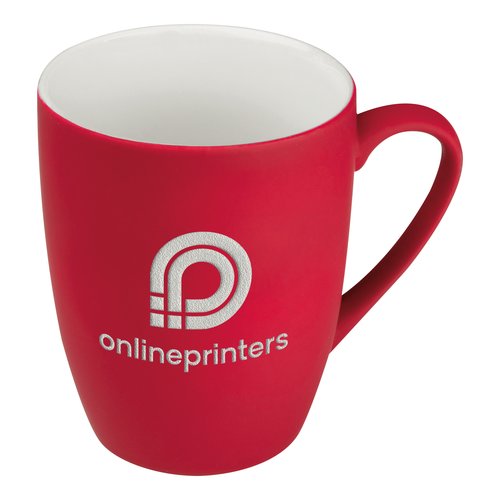 Taza roja de cermica con asa.