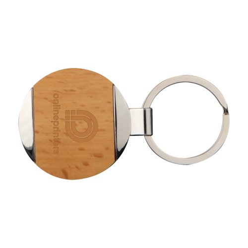 Llavero marrn de metal y madera con patrn y anillo metlico.