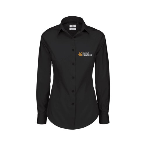 Blusa negra de tela con mangas largas y tapeta de botones.