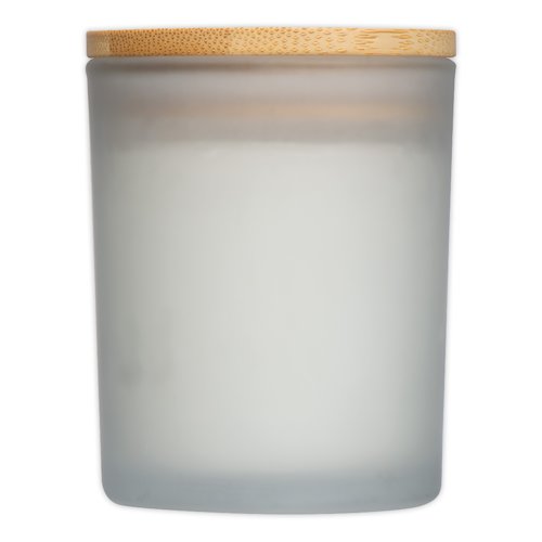 Vela blanca en vaso de vidrio con tapa de madera.
