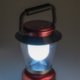 Linterna LED de camping roja con soporte y asa de transporte.