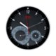 Reloj de pared negro con termmetro e higrmetro integrados.