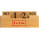 Calendario de escritorio de madera con bloques de fecha.