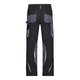 Pantalones de trabajo negros y grises de polister y algodn con mltiples bolsillos.